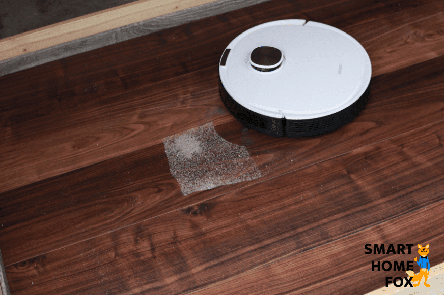 Ecovacs Deebot OZMO T8 vacuums sand during cleaning test on hard floor